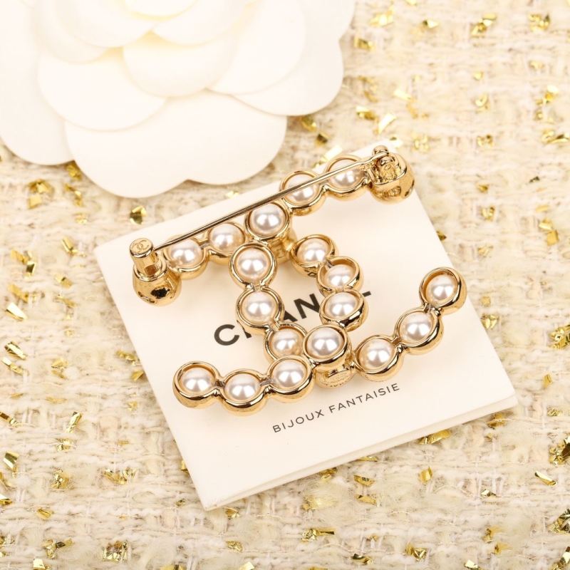 Ch**el brooches